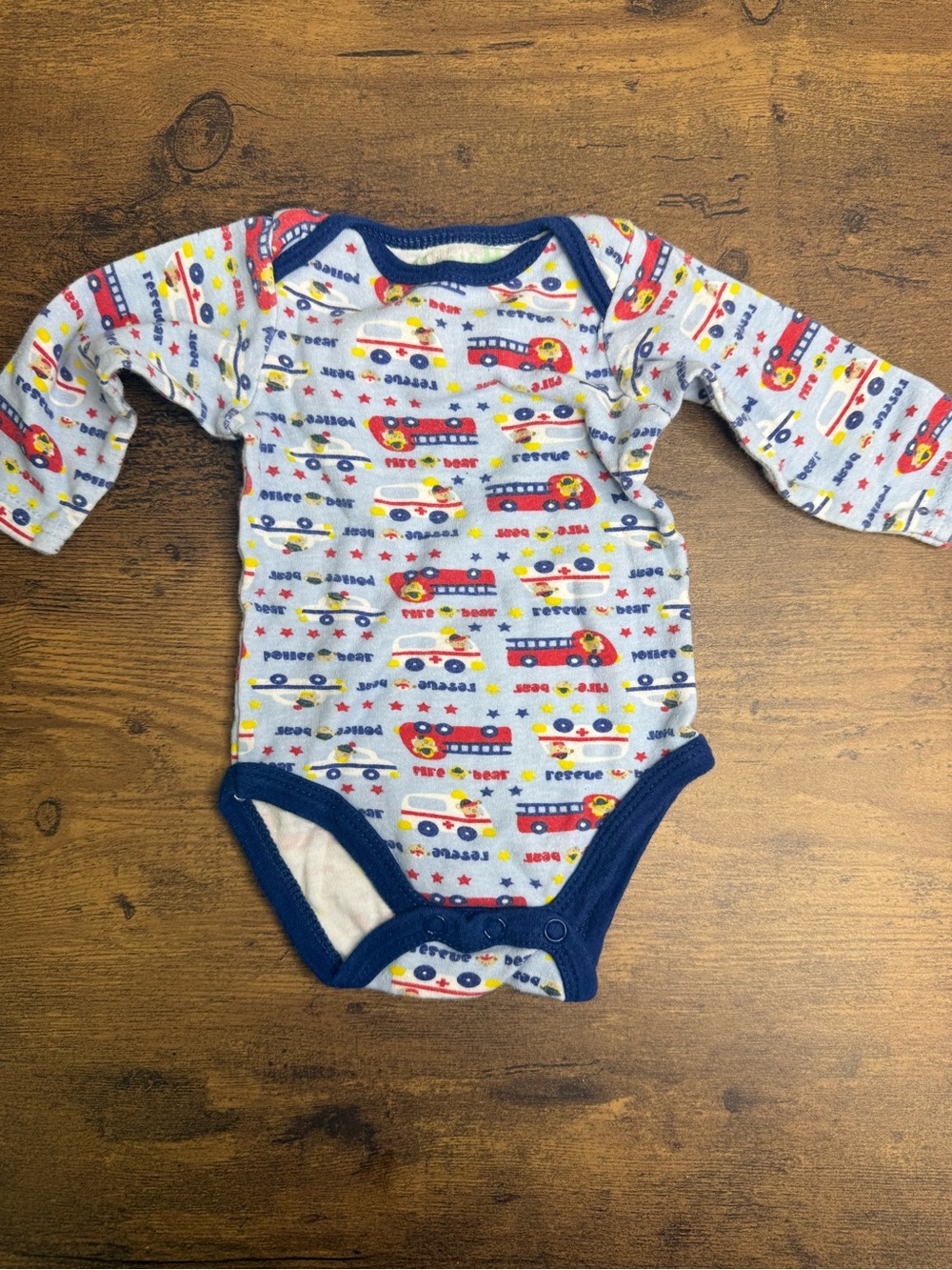 ⭐️5 for $20⭐️ Kristen Hanah Baby LS Onesie in White with Red & Blue Rescue Print